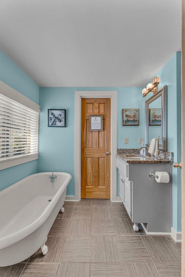 The 1912 cast iron bearclaw bathtub — Naismith House