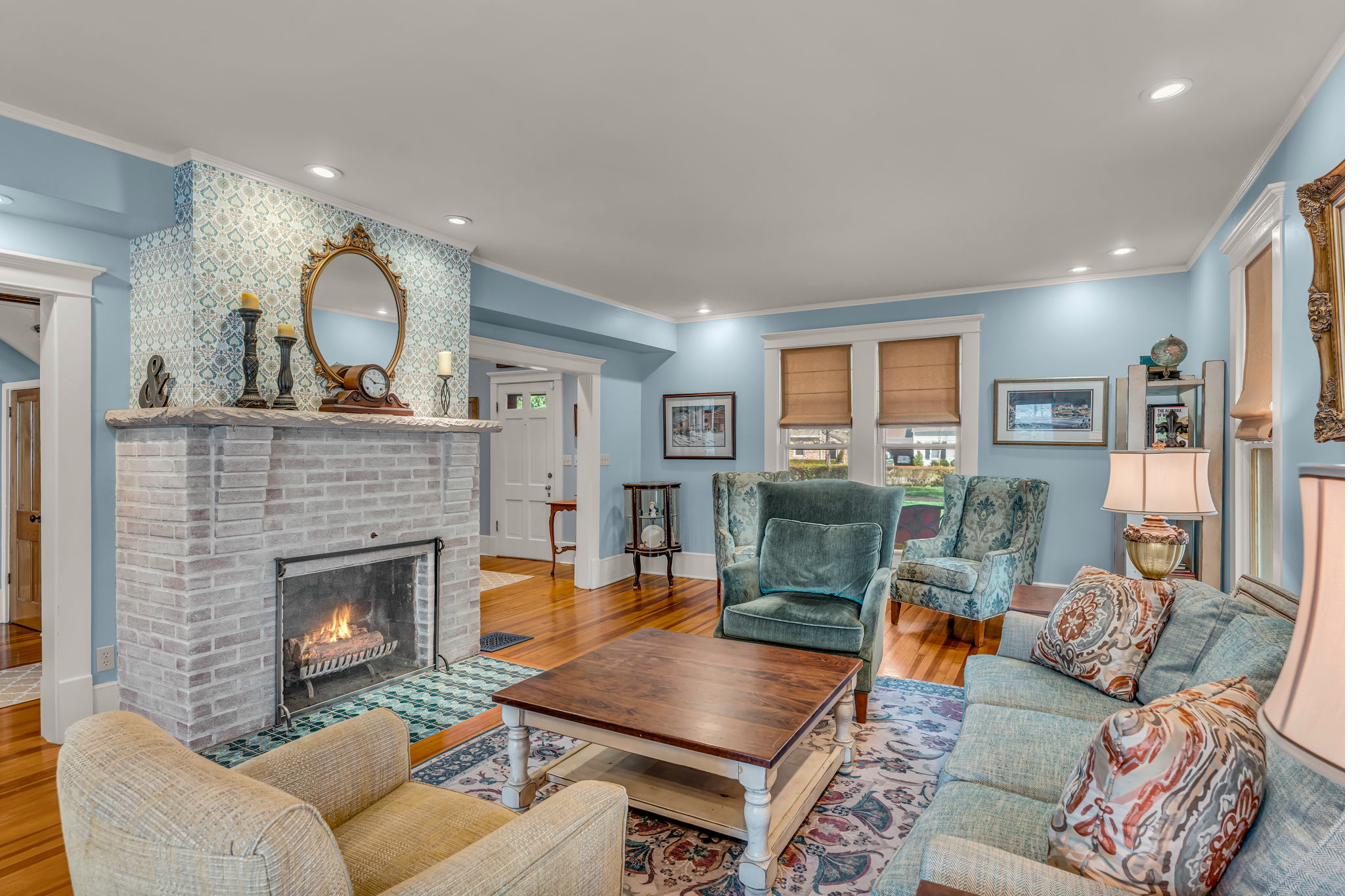Naismith House living room with original brick fireplace